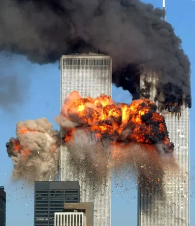 Flames and smoke engulfing the Twin Towers during a major catastrophe.